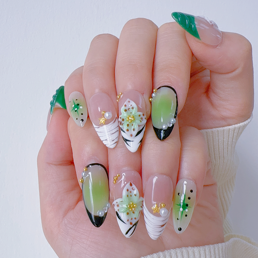 On-hand try-on of Mint Floral Whisper nails showing matcha green aura and 3D petals