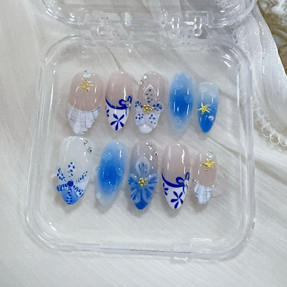Mermaidcore blue almond press-on nails flat lay | Mermaidcore manicure inspo