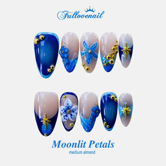 Moonlit Petals medium almond press-on nails with 3D blue flowers and French tips