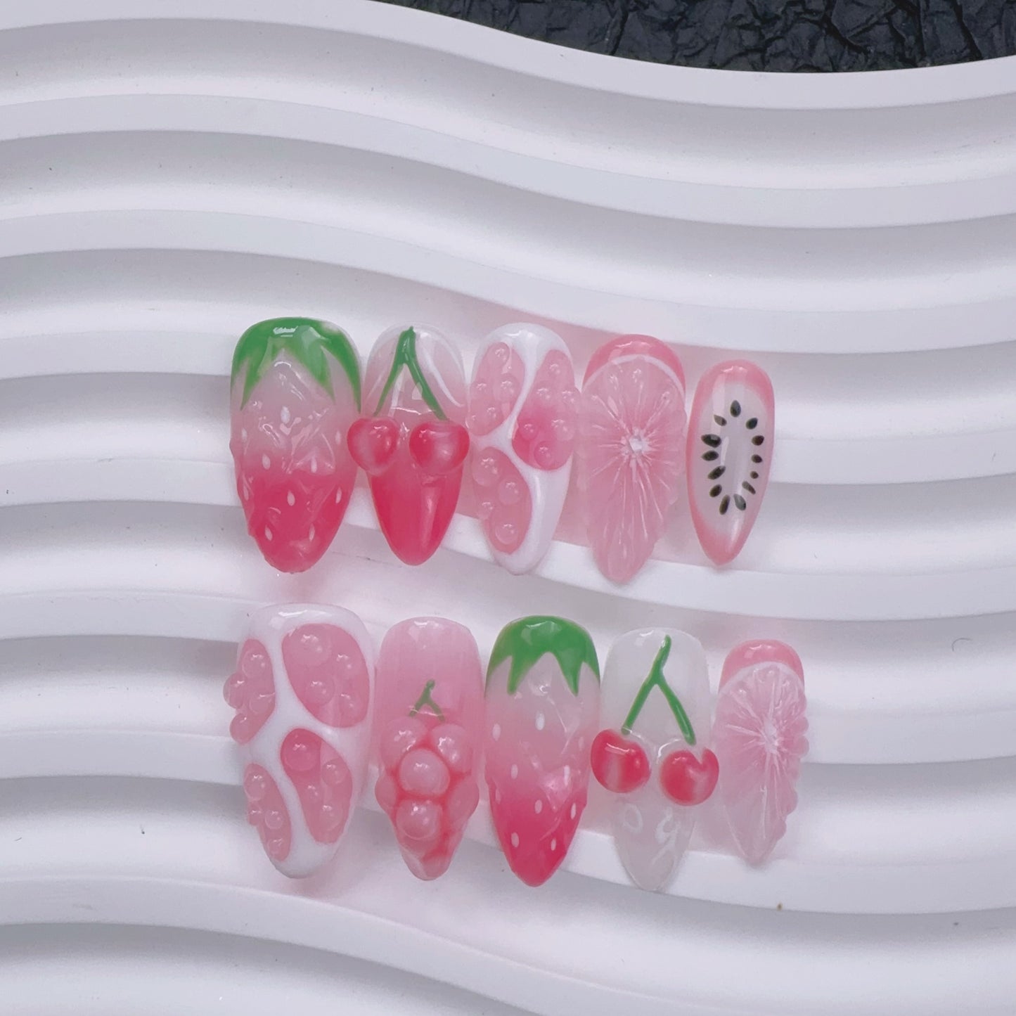 Berry Enchanted Princess nail art flat lay close-up showing handcrafted art detailing on almond nails