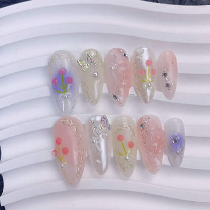 Full 10-piece flat lay display of Fairy Secrets 3D floral and ribbon bow nails