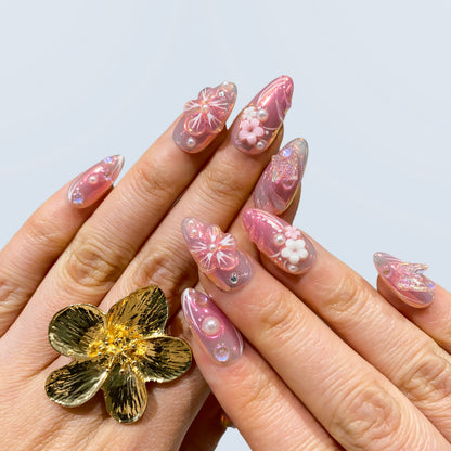 Wear display of Luminous Dream almond press-on nails paired with gold flower ring