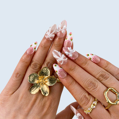 Coquette pink press-on nails on hand | Coquette nail inspo