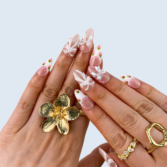 Coquette pink press-on nails on hand | Coquette nail inspo