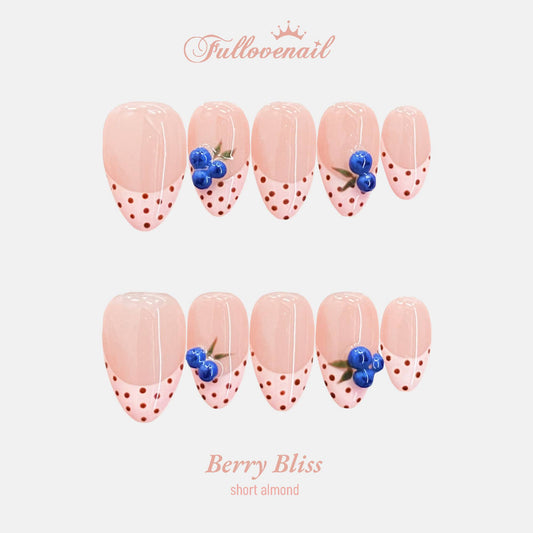 Berry Bliss handmade press-on nails — short almond set in red and handcrafted art detailing | Fullovenail