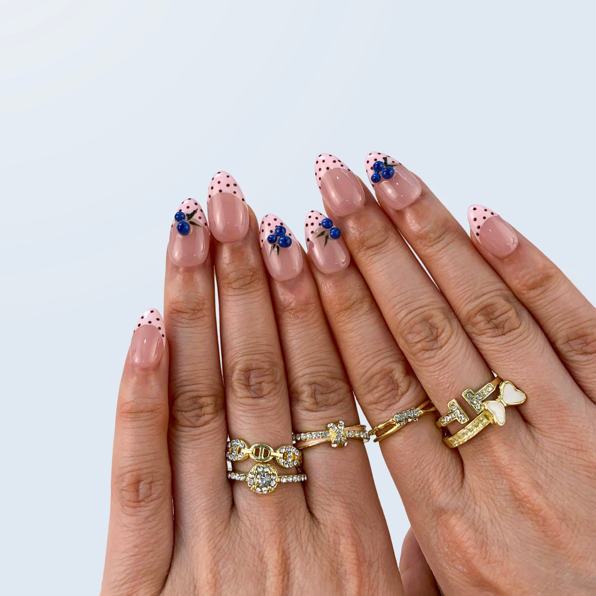 Salon quality Berry Bliss reusable gel press-on nails with custom sizing on natural hands