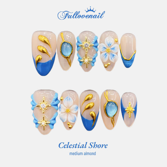 Celestial Shore almond press-on nails with ocean blue French tips and 3D gems