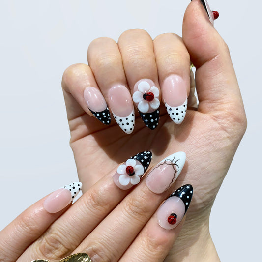 Coquette pink rhinestone and glitter press-on nails on hand | Y2K romance nail inspo