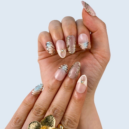 Salon quality Aurora Veil reusable gel press-on nails with custom sizing on natural hands