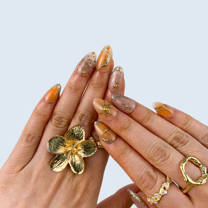Stellar Glow nail art close-up showing handcrafted art detailing on almond nails
