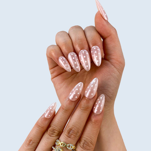 Retro chic black and white polka dot French nails on hand | Vintage Parisian nail inspo