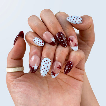 Classic black and white polka dot French nails on hand | Parisian vintage nail inspo