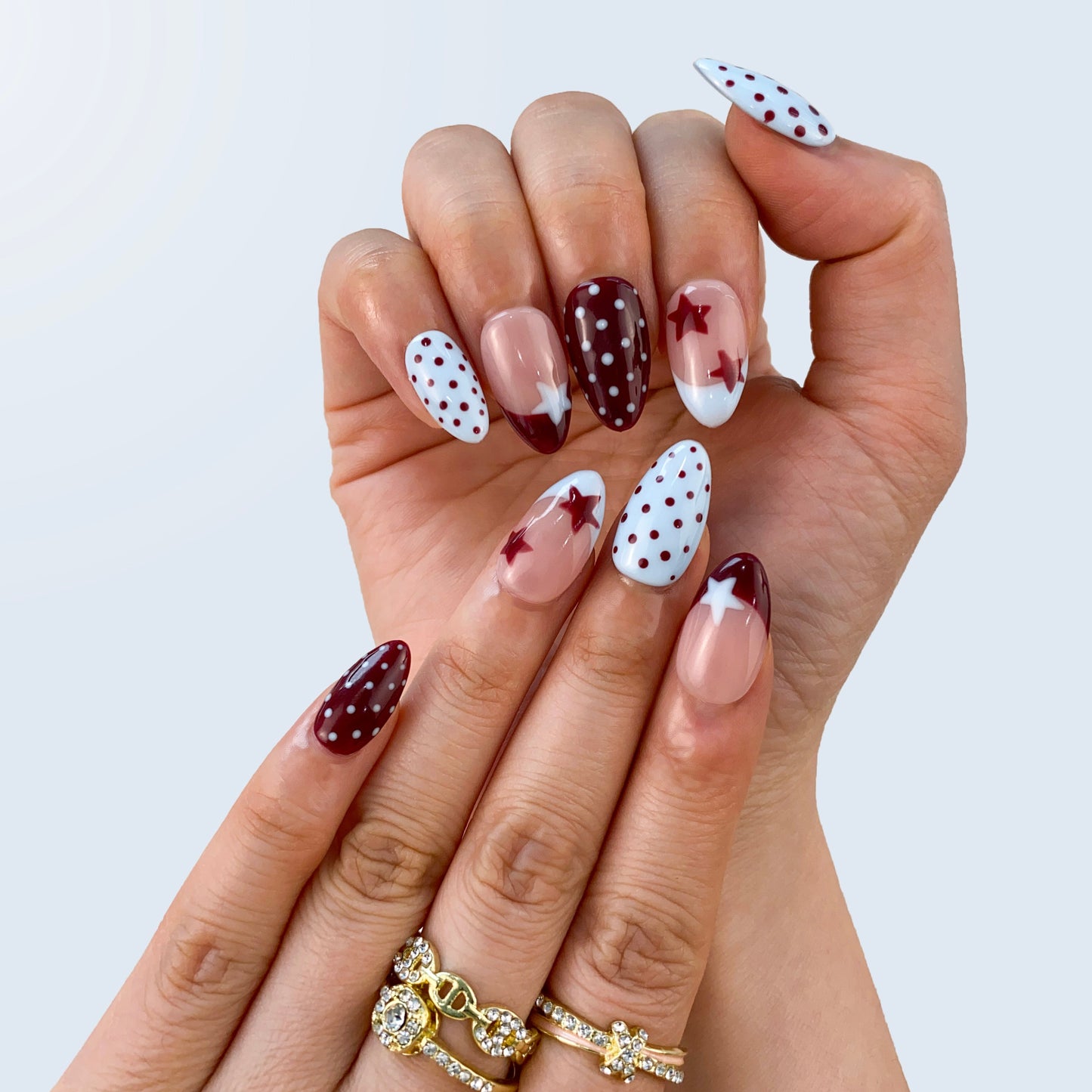 Vintage Polka Elegance nail art close-up showing handpainted micro polka dots on almond nails