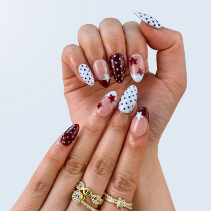 Vintage Polka Elegance nail art close-up showing handpainted micro polka dots on almond nails