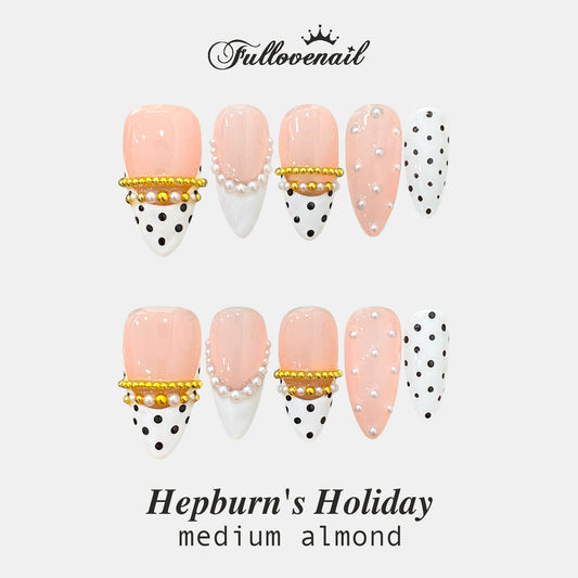 Hepburn's Holiday handmade press-on nails — medium almond set in festive red and handcrafted art detailing | Fullovenail