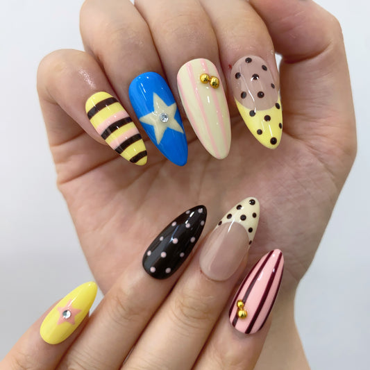 Playful multi-color dopamine abstract swirl nails on hand | Y2K festival nail inspo