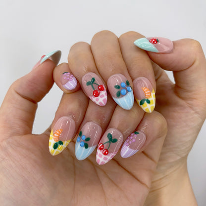 Handcrafted coral orange gel fake nails in natural light for everyday wear and special occasions
