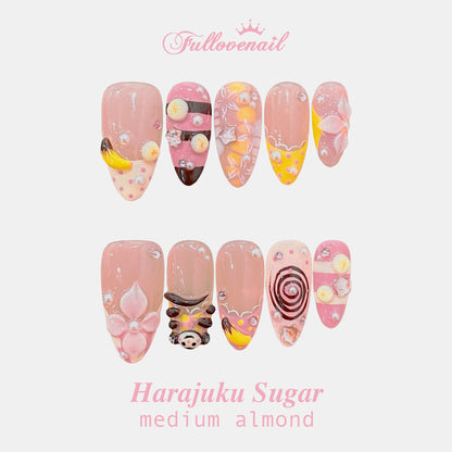 Harajuku Sugar medium almond press-on nails with 3D dessert charms and pink floral art