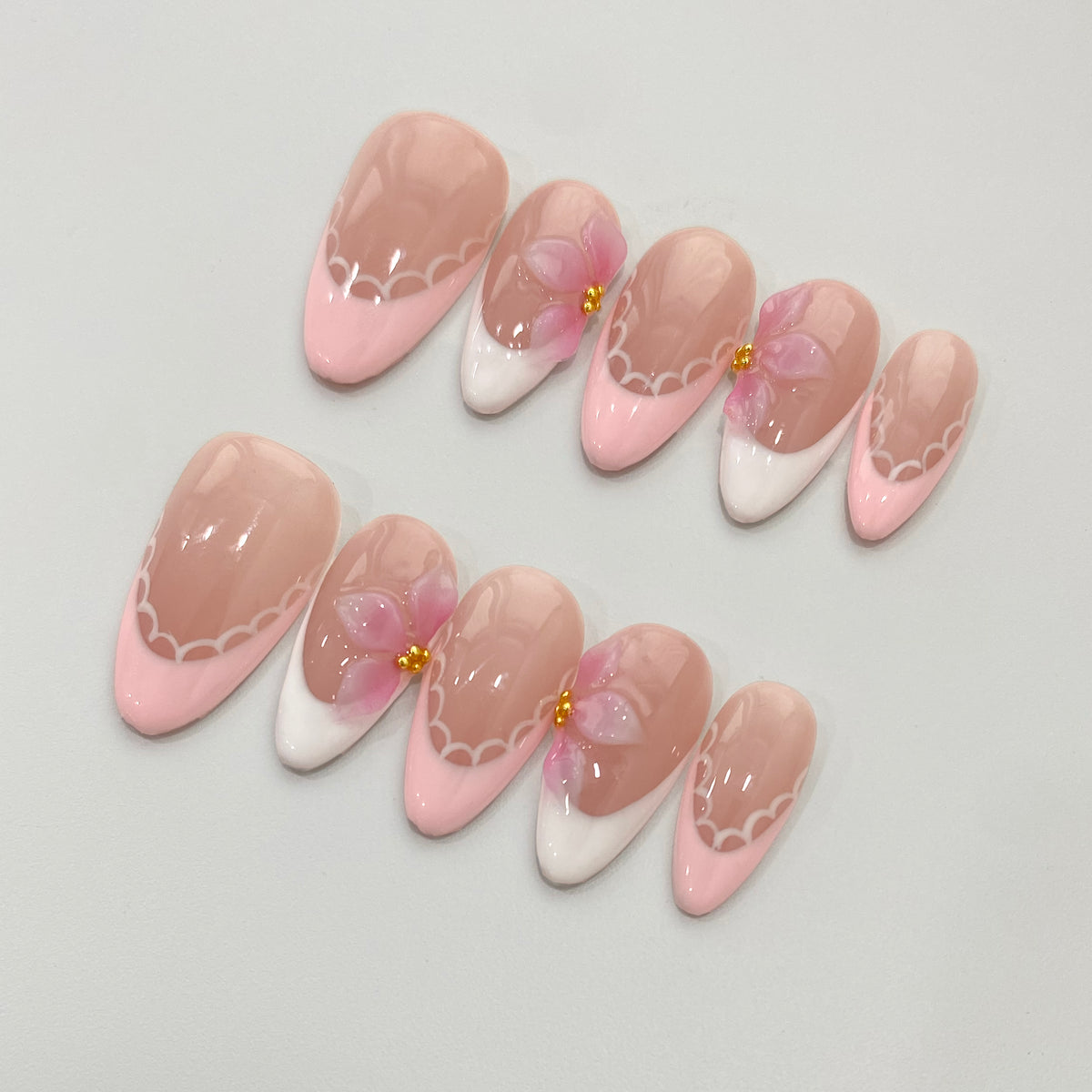 Full 10-piece flat lay display of Ballet Bloom floral French press-on nails