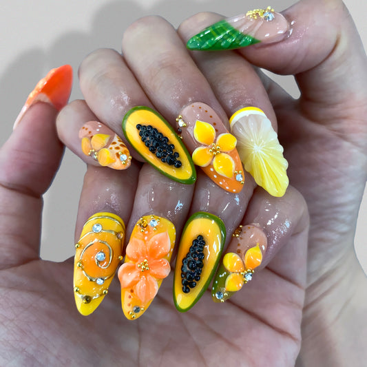 Earthy Chic coral orange press-on nails on hand | Earthy Chic nail inspo