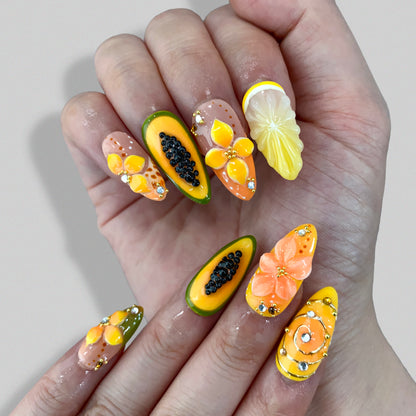 Full set wear display of Papaya Splash vibrant tropical fruit almond nails