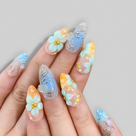 Mermaidcore blue press-on nails on hand | Mermaidcore nail inspo