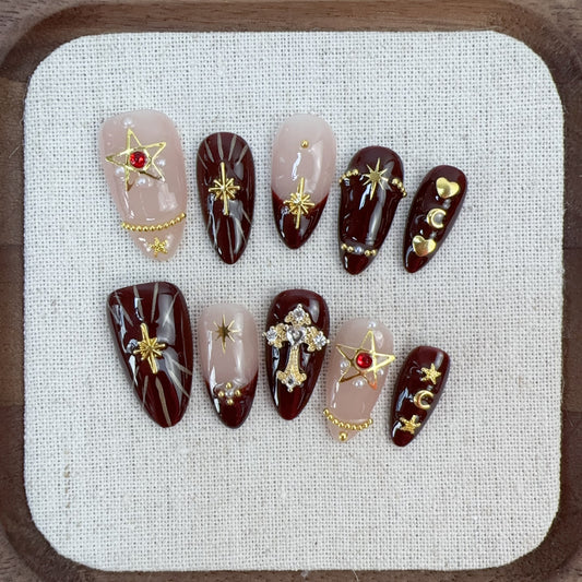 Golden Sparkle nail art close-up showing handcrafted art detailing on almond nails