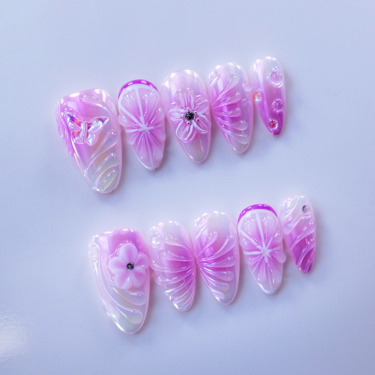 Coquette lavender purple blush press-on nails flat lay | Soft purple aesthetic nail inspo