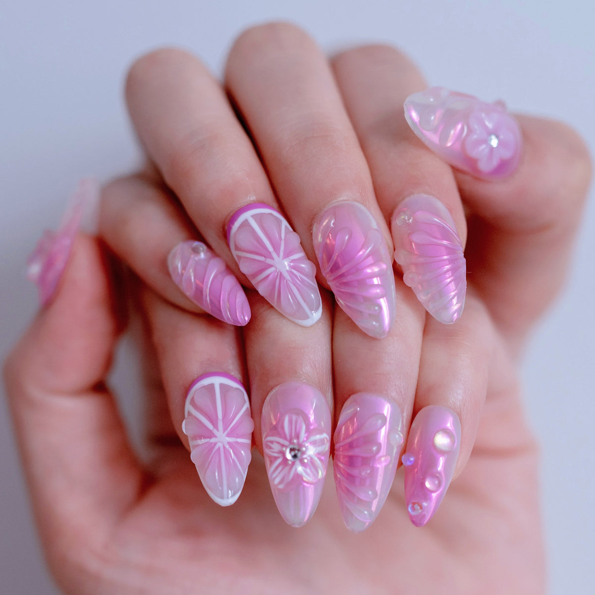 Purple Blush nail art close-up showing handcrafted art detailing on almond nails